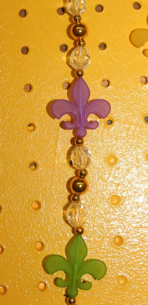 PURPLE, GREEN, AND GOLD MATTE FINISH FLEUR DE LEIS