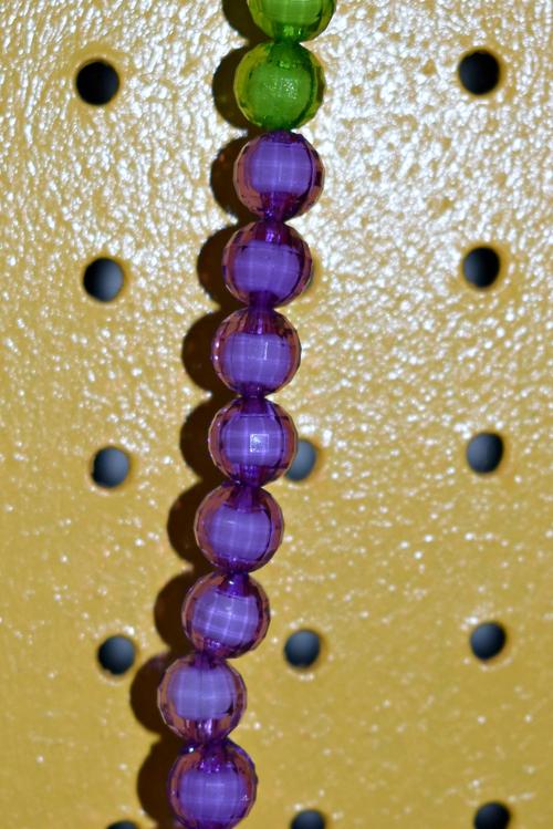 PURPLE, GREEN, AND GOLD MIRACLE BEAD